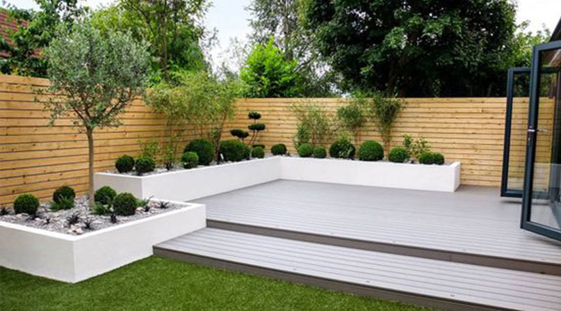 white interior of outdoor space with decoration of plants,